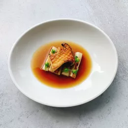 Fermented Mushroom and toasted barley broth, coal-grilled king oyster mushroom, salsify and tarragon emulsion