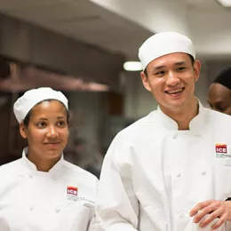 Culinary school students smiling in class at ICE