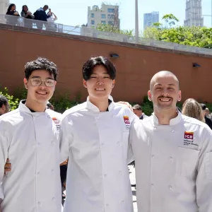 ICE graduate Steven Gao and two other ICE graduates smile at ICE's commencement ceremony