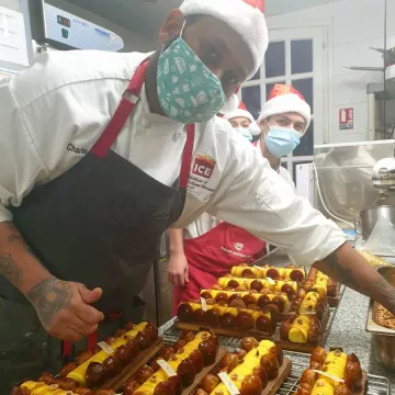 Charles Taylor making pastries with classmates