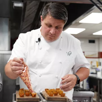 Chef Eric Klein pipes tuna filling into small cones