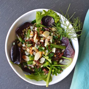 A lentil salad is served.