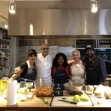 People cooking in the Saveur test kitchen