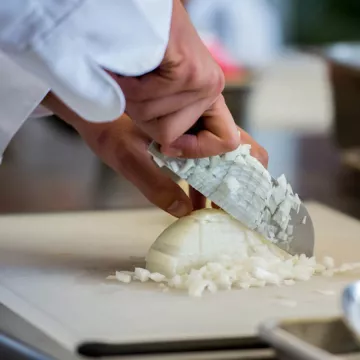 chef chopping onions