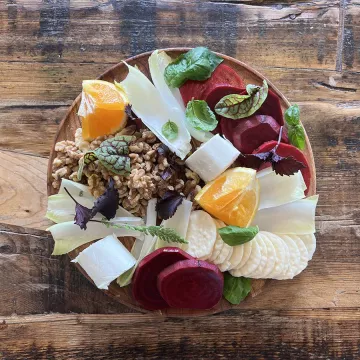 A fermented beet grazing board on a wooden plate