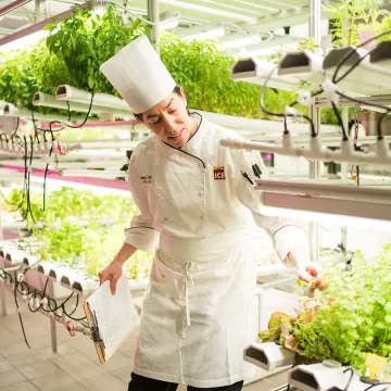 Director of Nutrition Celine Beitchman teaches in the hydroponic garden