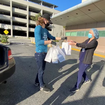 Mattia Corbia delivers prepared meals to health care workers.