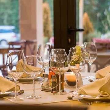 Wine glasses on a restaurant table.