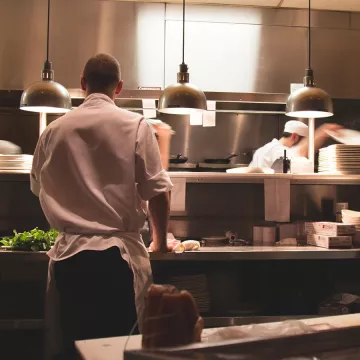 A chef expediting in the kitchen.