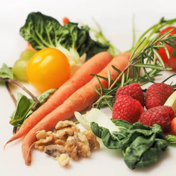 A selection of fruits and vegetables on a white background