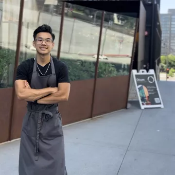 ICE Alum and Chef Matthew Tran stands in front of Otium