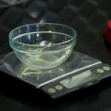 A kitchen scale with a bowl for measurements