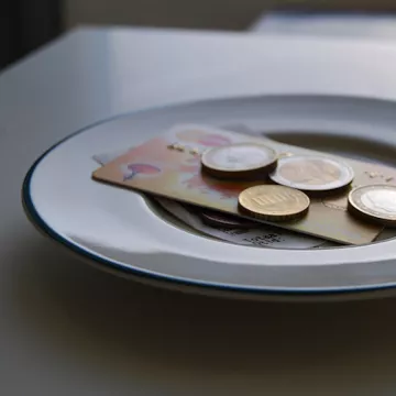 check and cash on table at a restaurant