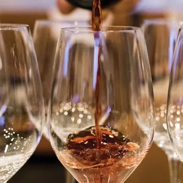 wine being poured into a glass