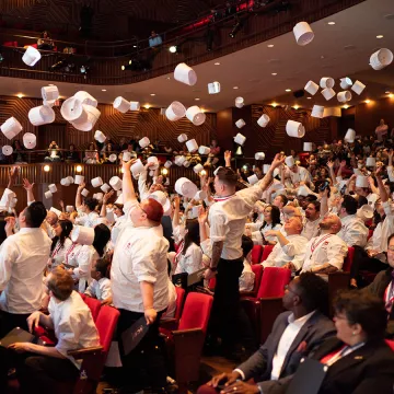 ICE graduates toss their toques at the 2019 commencement.