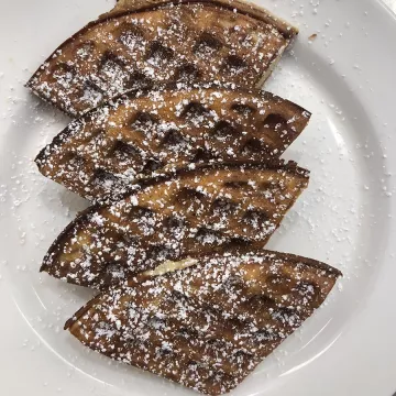 Waffles dusted with powdered sugar