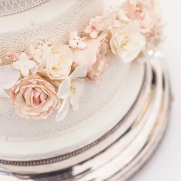 A decorated wedding cake with sugar flowers