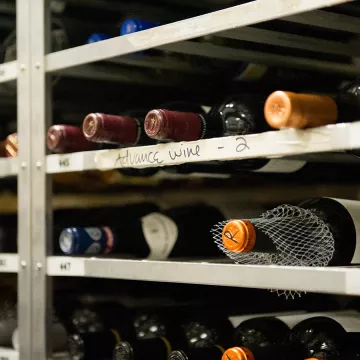 Bottles of wine on a shelf.