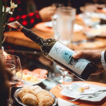 A server pours wine at a restaurant