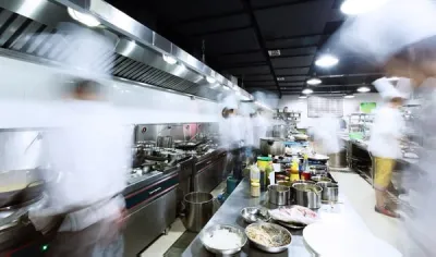 Culinary class in a fast-pasted kitchen.