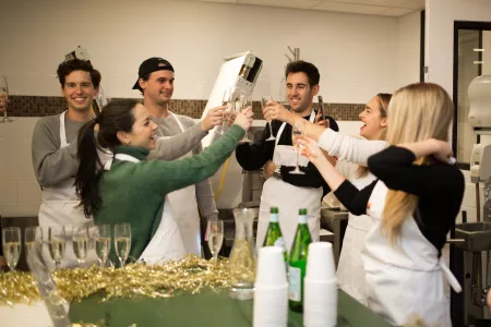 Guests toast before a class