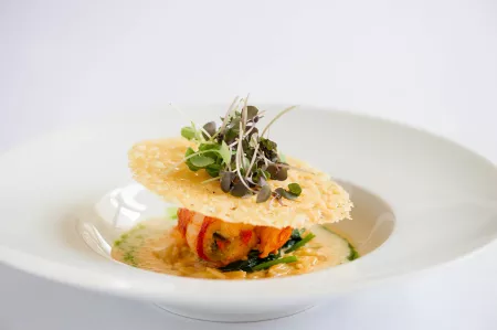 A dish of lobster and parmesan crisp, plated at the Institute of Culinary Education