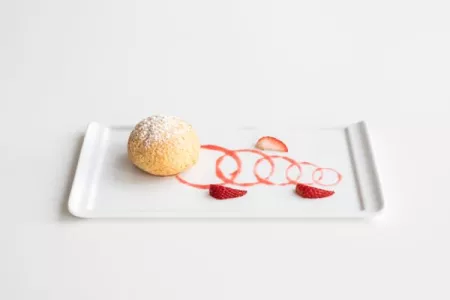 Plated dessert of crunchy choux pastry and strawberries prepared by ICE pastry arts and baking arts students