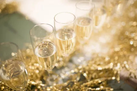Champagne poured in glasses for a holiday event.