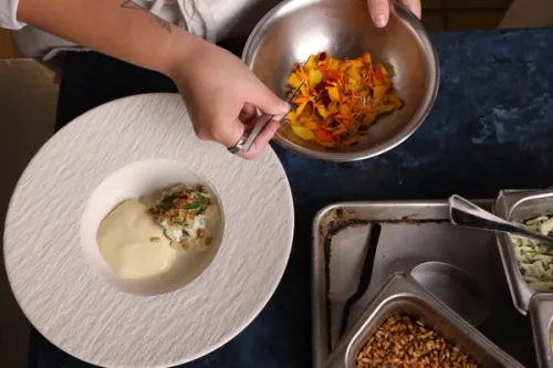 an aerial shot of several dish components on a prep table