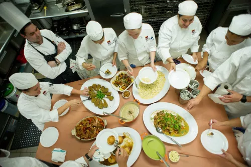 Students taste the food they made in culinary school at the Institute of Culinary Education