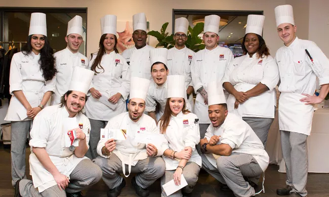Culinary school students celebrate their graduation day at the Institute of Culinary Education