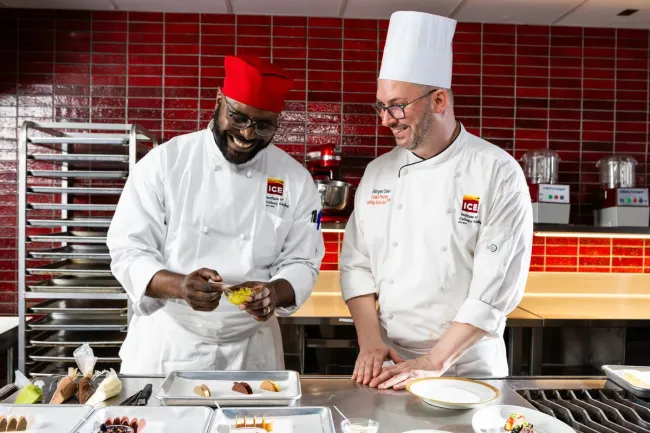 an Advanced Pastry & Baking Technique student works alongside a Chef-Instructor