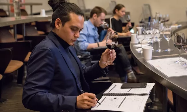 Students taste wine in the Intensive Sommelier Training class