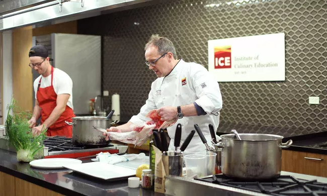 Bill Telepan demonstrates breaking down a whole fish at the Institute of Culinary Education