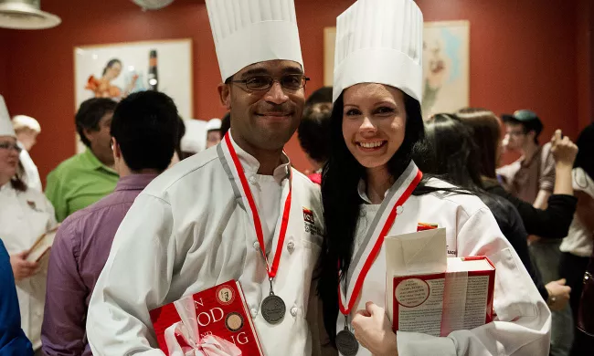 Pastry arts students pose with their awards medals at their graduation ceremony