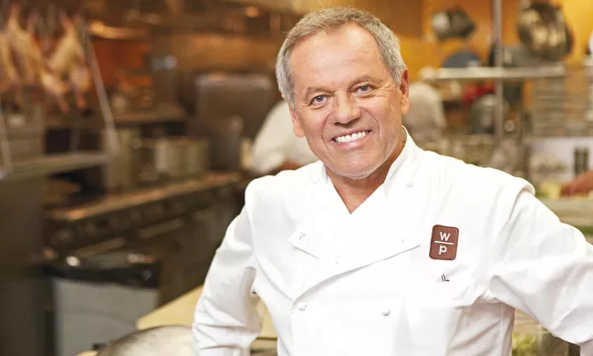 Chef Wolfgang Puck in his restaurant in New York