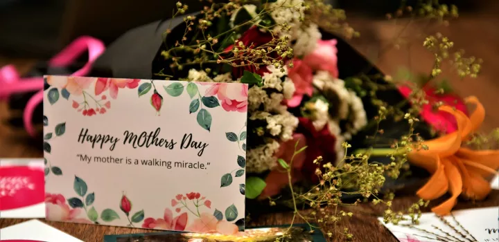 A Mother's Day card and bouquet of flowers
