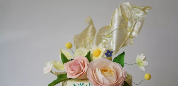 A cake decorated with rice paper sails