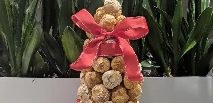 A croquembouche with a ribbon.