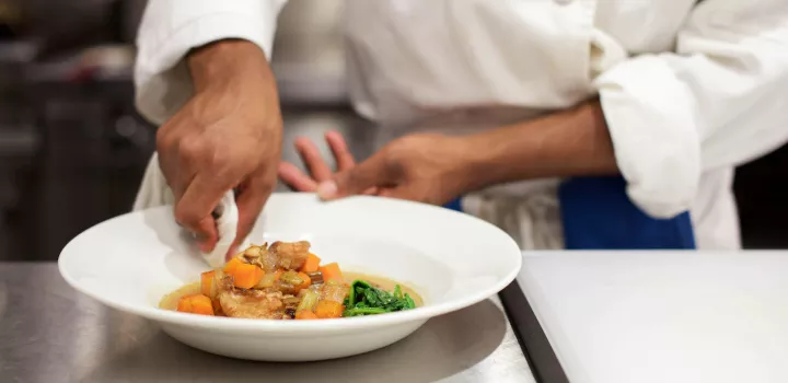 ICE student plating a dish