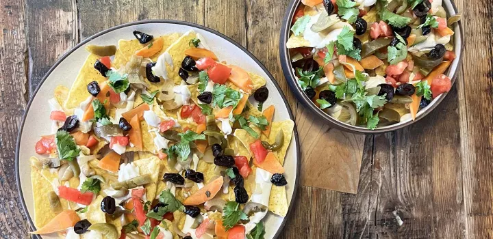 Nachos topped with fermented vegetables and cashew cream