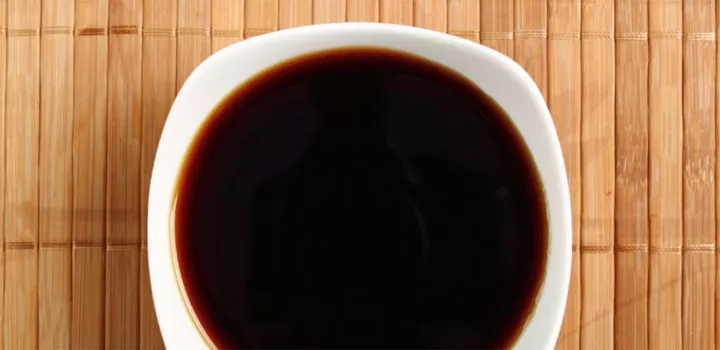 A bowl of soy sauce.