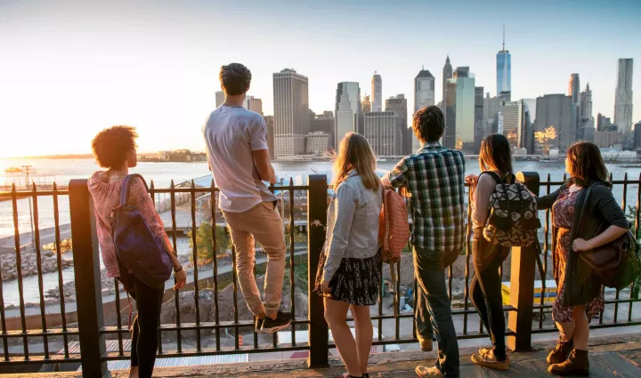 Students look across the East River of New York to downtown Manhattan, where the Institute of Culinary Education is located