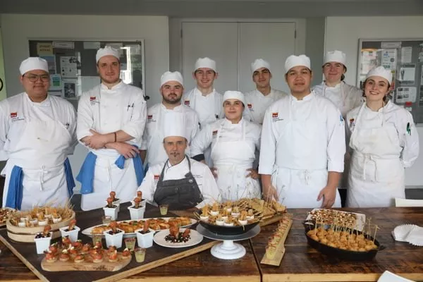Students Celebrate Their Final Day Of Class with Chef-Instructor